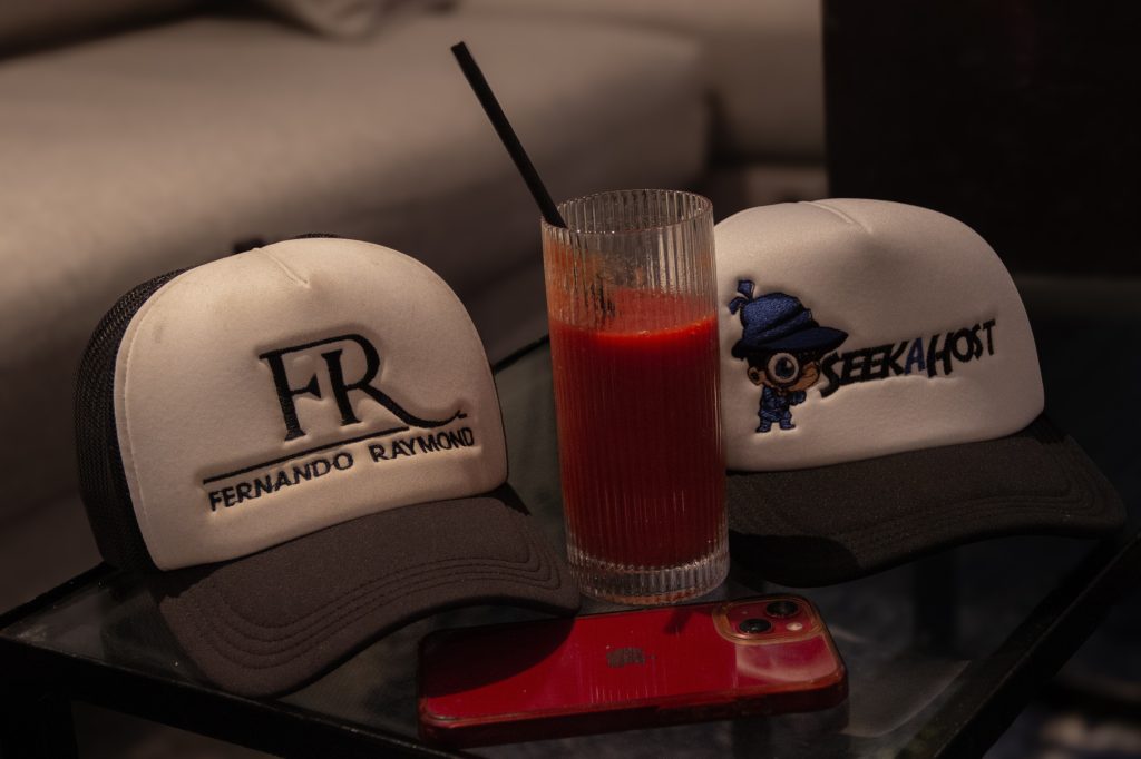 Fernando-Raymond-and-SeekaHost-brands-on-caps